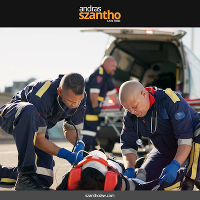 Paramedics treating a personal injury victim on a stretcher after an accident in Santa Fe, NM
