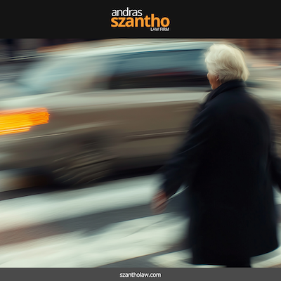 A pedestrian crossing the street in Santa Fe, New Mexico while passing car speeds by