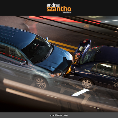 Two cars involved in a nighttime accident at an intersection in Albuquerque, NM