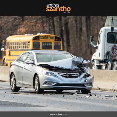 A grey car with a smashed front end after a car accident in Albuquerque